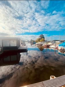 a view of a marina with boats in the water at Amsterdam Boathouse in Aalsmeer