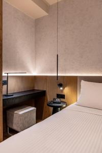 Ένα ή περισσότερα κρεβάτια σε δωμάτιο στο Evanik Chic Hotel