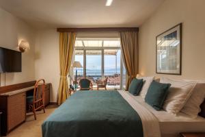 Postel nebo postele na pokoji v ubytování Grand Hotel Bonavia + 37 fotografií