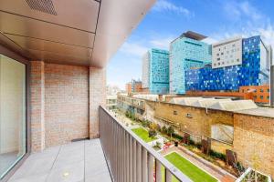 an apartment balcony with a view of a city at 1Bed apt in Whitechapel with a balcony & near tube in London