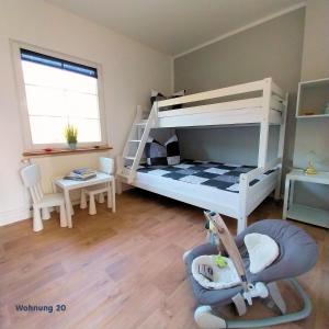 Postel nebo postele na pokoji v ubytování Zeit für Erholung, Ferienhaus A&C Prudlo, Usedom