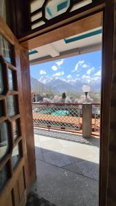 a view from a door of a balcony with a view at Baltistan Continental in Skardu