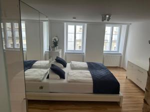 Postel nebo postele na pokoji v ubytování City-Center Apartments