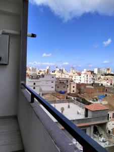 a view of a city from a balcony at APPARTEMENT AMINE in Delmonte