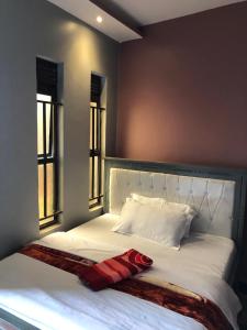 Postelja oz. postelje v sobi nastanitve Galaxy Executive INN,Bar & Restaurant Wakiso