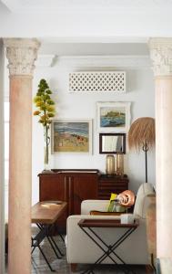 a living room with a couch and a table at VILLA EDO in Gammarth