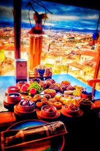 a table with many different types of food on it at Sakli Cave House in Avanos