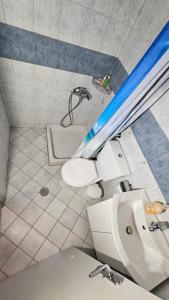 a bathroom with a sink and a bath tub at ASTORIA lindos in Lindos