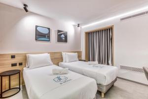 Postel nebo postele na pokoji v ubytování JL Hotel + 44 fotografií