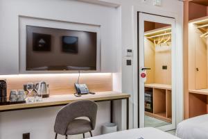 Ένα ή περισσότερα κρεβάτια σε δωμάτιο στο JL Hotel