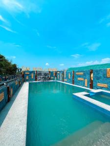 a swimming pool on the roof of a resort at Solis Mansion and Resort in Lingayen