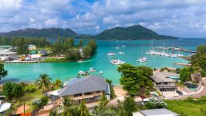 a view of a harbor with boats in the water at Cavern Apartments in Baie Sainte Anne