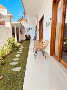 a row of chairs sitting on a patio at Y&J in Seminyak +8 photos