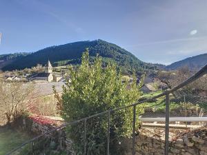 a view of a town with a mountain at Authenticité, jardin, terrasse et vue in Chanac +6 photos
