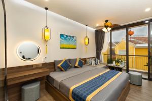 Postel nebo postele na pokoji v ubytování Hai Hội Villa Hoi An + 37 fotografií