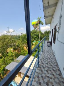 Un balcón o terraza de GREEN PEPPER HOME STAY