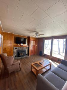 a living room with a couch and a coffee table at Tally Ho Inn in Huntsville