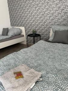 Rúm í herbergi á Apartement Kingsize