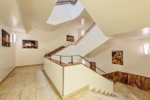 a staircase in a house with white walls at CityClass Hotel am Dom in Cologne