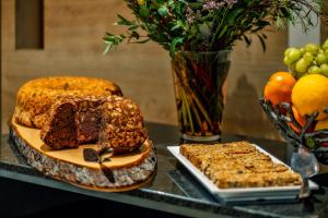 a table with a cake and other desserts on it at CityClass Hotel am Dom in Cologne