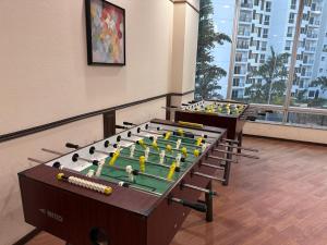 two billiard tables in a room with at Tranquil Haven Retreat - near Bangalore International Exhibition Centre in Nelamangala