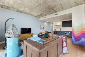 a living room with a couch and a table at Austin Condo Hotel in Austin