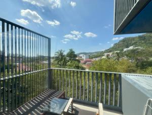 a balcony with a view of a city at The Deck Condominium by Lofty in Patong Beach