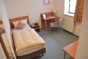 Postel nebo postele na pokoji v ubytování Rosenhotel Scherer