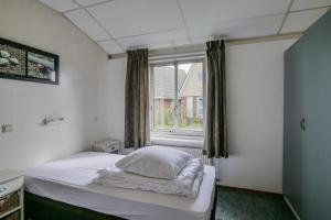 Postel nebo postele na pokoji v ubytování De Duin Haven - Seinpost 03 - Callantsoog