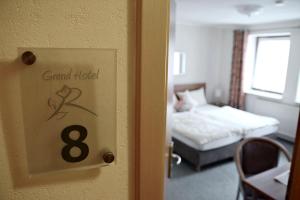 Postel nebo postele na pokoji v ubytování Rosenhotel Scherer