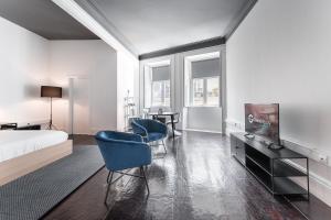 Una televisión o centro de entretenimiento en GuestReady - Innvict Residences