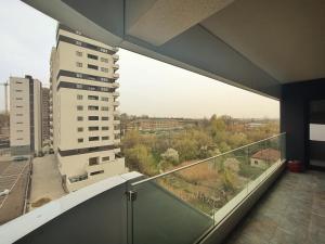 a balcony with a view of a city at Premium Apartment with Free Parking and Shop near Airport in Iaşi