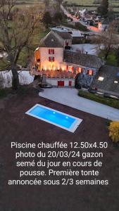 an advertisement for a house with a swimming pool at Le Moulin des Ducs in Épinac-les-Mines