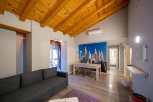 a living room with a couch and a table at Apartamentos GO - Leopoldo Cano Center in Valladolid