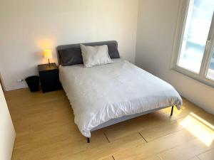 מיטה או מיטות בחדר ב-Le Marco Yourhosthelper Conciergerie