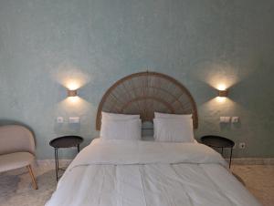 a bedroom with a large white bed with two lamps at Casa Do Carmo - Castle Views! in Sintra