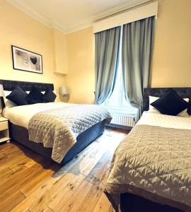 En eller flere senger på et rom på Waterloo Lodge