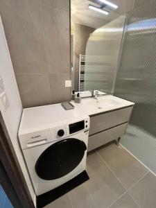 Koupelna v ubytování Refuge En Ville - Appart Cosy avec Garage + 15 fotografií