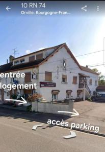 a large white building on the side of a street at Appartement Le Dauphin 