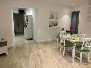 a kitchen and dining room with a table and chairs at Il Profumo di Capri in Massa Lubrense
