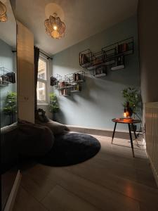 a living room with a couch and a table at Modern Sea View Apartment in Margate