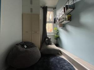 a room with two bean bags in the corner of a room at Modern Sea View Apartment in Margate +16 photos