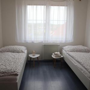 Postel nebo postele na pokoji v ubytování Nad Sklepy