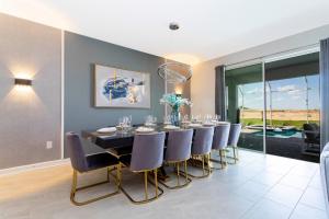 Et opholdsområde på 9332 SH - Champions Gate Unique Luxury 8BR + 43 billeder