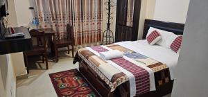Llit o llits en una habitació de Hotel Simara
