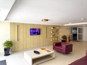 a living room with a couch and a table at Pipas Bay in Pipa