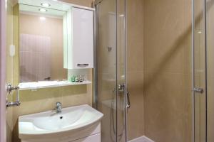 a bathroom with a sink and a shower at Noble House in Kriva Palanka