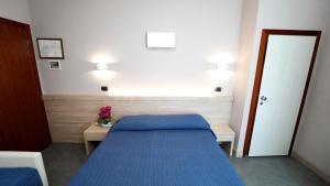Postel nebo postele na pokoji v ubytování Hotel King