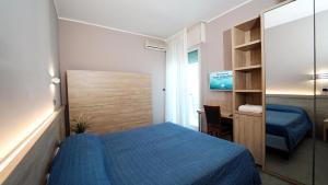 Postel nebo postele na pokoji v ubytování Hotel King