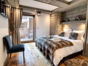 En eller flere senge i et værelse på Annapurna-appartement-6pers-proche centre